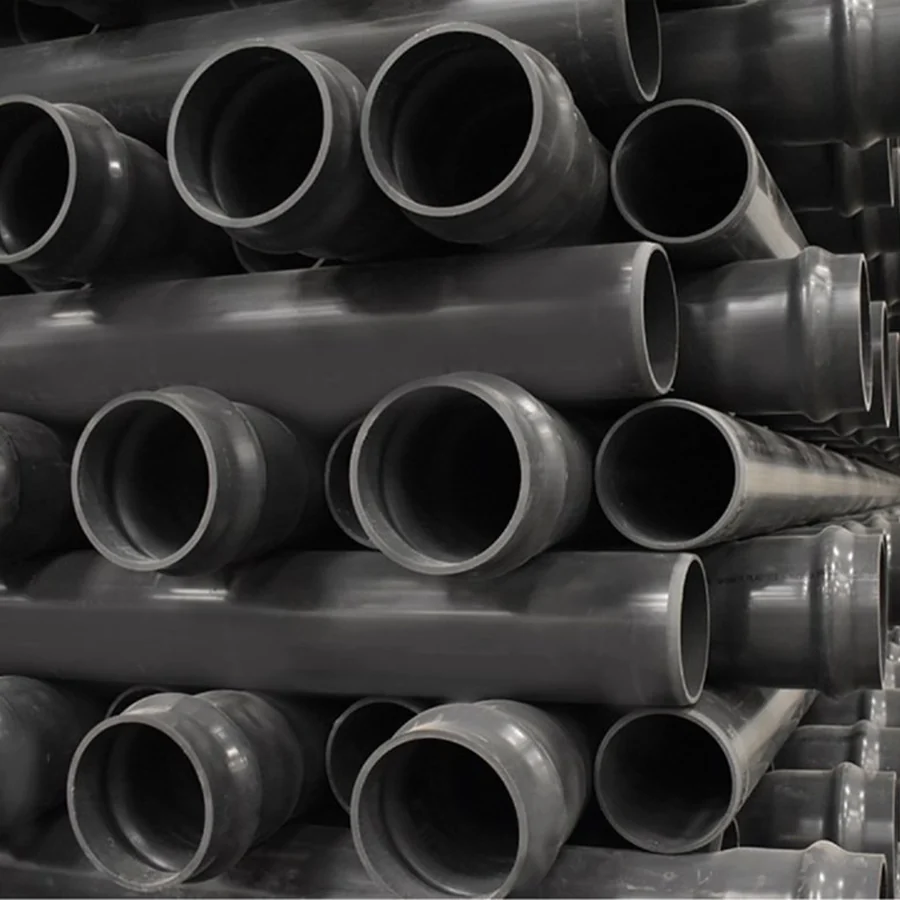 Black pipes stacked in storage